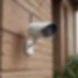 Modern wireless security camera mounted on a home exterior