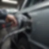 Fuel nozzle inserted into a car's gas tank