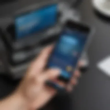 Hand holding a smartphone with PayPal app open