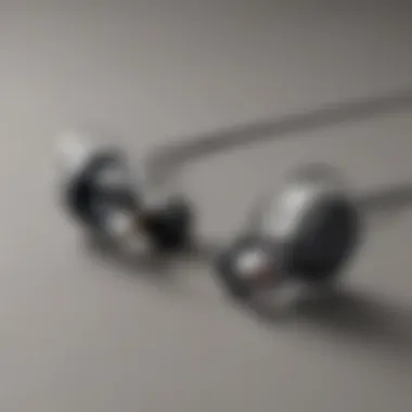 Elegance in Connectivity Sleek design of wireless earbuds with connecting wire