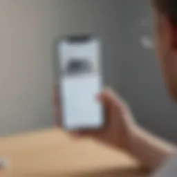 An individual blocking a call on a smartphone